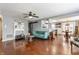 Open concept living space with hardwood floors, decorative fireplace, and comfortable seating at 7 Pondview Ct, Brownsburg, IN 46112