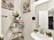 Powder room with decorative shelves, wall art, and a modern vessel sink at 7252 Lockford N, Avon, IN 46123