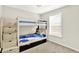 Bright bedroom featuring a bunk bed with stairs and a window providing natural light at 7252 Lockford N, Avon, IN 46123