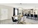 Dining area with a marble table and modern lighting, adjacent to the kitchen at 7252 Lockford N, Avon, IN 46123