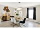 Modern dining room featuring a marble table, chandelier, and stylish decor at 7252 Lockford N, Avon, IN 46123