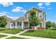 Inviting front of the home features a cozy porch, well-maintained lawn, and mature trees at 7252 Lockford N, Avon, IN 46123