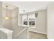Upstairs hallway features natural light from a window and decorative light fixtures at 7252 Lockford N, Avon, IN 46123