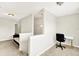 Upstairs hallway features a view of a small office space and a comfortable couch at 7252 Lockford N, Avon, IN 46123