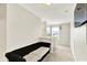 Upstairs hallway with a comfortable couch and a view of another room through the window at 7252 Lockford N, Avon, IN 46123