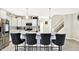 Kitchen island featuring barstool seating, stainless steel appliances, and pendant lighting at 7252 Lockford N, Avon, IN 46123