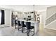 Kitchen with island seating, stainless steel appliances, and modern cabinetry at 7252 Lockford N, Avon, IN 46123