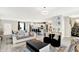 Open concept living room featuring stylish furniture and decor, connecting to the kitchen at 7252 Lockford N, Avon, IN 46123