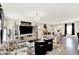 Bright, spacious living room with stylish furnishings, a large TV, and a dining area at 7252 Lockford N, Avon, IN 46123
