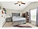 Spacious bedroom with vaulted ceiling, ceiling fan, and decorative shelves with handbag collection at 7252 Lockford N, Avon, IN 46123