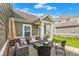 Inviting outdoor patio with a seating arrangement and umbrella for relaxing or entertaining at 7252 Lockford N, Avon, IN 46123