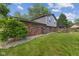 A spacious backyard featuring a brick house with a deck and a charming gazebo at 750 Hillcrest Dr, Greenwood, IN 46142