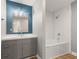 This bathroom features a vanity, tub, and shower area with modern white tile backsplash at 750 Hillcrest Dr, Greenwood, IN 46142