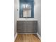 This bathroom features a vanity, a decorative mirror, and neutral wall color at 750 Hillcrest Dr, Greenwood, IN 46142