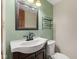 Charming bathroom with traditional vanity, decorative mirror, and classic fixtures at 750 Hillcrest Dr, Greenwood, IN 46142