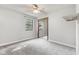 Bedroom includes a mirrored closet, a ceiling fan with light, and a window at 750 Hillcrest Dr, Greenwood, IN 46142