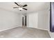 This bedroom offers neutral walls, carpet floors, and a ceiling fan with light at 750 Hillcrest Dr, Greenwood, IN 46142