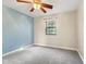 The bedroom features a window, neutral paint, carpet floors and a ceiling fan at 750 Hillcrest Dr, Greenwood, IN 46142