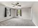 Neutral bedroom with carpet, multiple windows and modern ceiling fan at 750 Hillcrest Dr, Greenwood, IN 46142