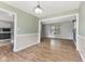Bright dining room area with wood floors and neutral wall colors at 750 Hillcrest Dr, Greenwood, IN 46142