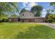 Charming two-story home featuring a brick facade, attached garage, and a well-manicured lawn at 750 Hillcrest Dr, Greenwood, IN 46142