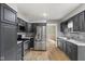 Modern kitchen with stainless steel appliances, dark cabinets, and ample counter space at 750 Hillcrest Dr, Greenwood, IN 46142