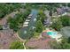 Aerial view showcasing the waterfront property, boat docks, pool and tennis court at 8069 Middle Bay Ln, Indianapolis, IN 46236