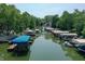 Waterfront aerial view of covered boat docks lined up along the river at 8069 Middle Bay Ln, Indianapolis, IN 46236