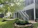 Lush backyard with a multi-level deck, stone patio, and mature trees at 8069 Middle Bay Ln, Indianapolis, IN 46236