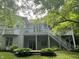 Backyard featuring a spacious deck, patio, and well-maintained lawn at 8069 Middle Bay Ln, Indianapolis, IN 46236