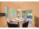 Cozy breakfast nook with a round table, four chairs, and natural lighting at 8069 Middle Bay Ln, Indianapolis, IN 46236