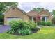 Charming stone-clad home with lush landscaping and an attached garage in a desirable neighborhood at 8069 Middle Bay Ln, Indianapolis, IN 46236