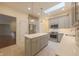 Spacious kitchen featuring gray cabinets, an island, and stainless steel appliances at 8069 Middle Bay Ln, Indianapolis, IN 46236
