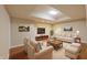 Open-concept living room with hardwood floors, plenty of seating, and natural light at 8069 Middle Bay Ln, Indianapolis, IN 46236