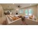 Bright living room with ample seating, fireplace, and access to the outdoors at 8069 Middle Bay Ln, Indianapolis, IN 46236
