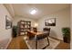 Well-lit office space with modern desk, shelving, and comfortable seating at 8069 Middle Bay Ln, Indianapolis, IN 46236