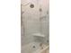 The glass shower has marble tile, a built-in seat, and a rainfall shower head at 8069 Middle Bay Ln, Indianapolis, IN 46236