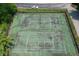 Aerial view of well-maintained tennis courts and a pristine green landscape at 8069 Middle Bay Ln, Indianapolis, IN 46236