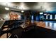 Home bar with a unique bar counter, jukebox, hardwood floors, and vintage trim at 825 E Washington St, Muncie, IN 47305