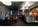 Home bar with a unique bar counter, jukebox, and vintage trim at 825 E Washington St, Muncie, IN 47305