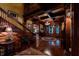 Stunning foyer showcasing wood trim, grand staircase, and elegant chandelier at 825 E Washington St, Muncie, IN 47305