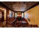 Hallway with stained glass windows, decorative ceilings, and detailed woodwork at 825 E Washington St, Muncie, IN 47305