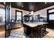 Bright kitchen with stainless steel appliances, tile floor, and island with seating at 825 E Washington St, Muncie, IN 47305