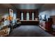 Relaxing living room features a built-in window bench, classic furniture, and a vintage lamp at 825 E Washington St, Muncie, IN 47305