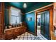 Charming pantry with custom cabinetry, wine racks, decorative tile flooring, and natural light at 825 E Washington St, Muncie, IN 47305