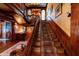 Beautiful staircase featuring wood trim and a decorative runner at 825 E Washington St, Muncie, IN 47305