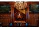Ornate entry hall featuring rich wood paneling, mural, decorative chandelier, and a grand staircase at 825 E Washington St, Muncie, IN 47305