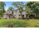 View of the back of the home showcasing the deck, porch and stairs to the upper level at 8435 Hilltop Ln, Martinsville, IN 46151