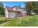 Angled view of the back of the home showing the wooden stairs and access to the second level deck at 8435 Hilltop Ln, Martinsville, IN 46151