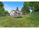 A backyard view that includes the upper and lower decks with yard space for activities at 8435 Hilltop Ln, Martinsville, IN 46151
